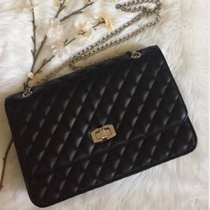 Quilted black purse with silver black chain